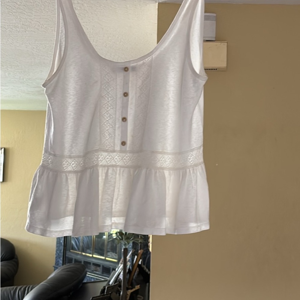 Brand new sleeveless top. Fits just under the belly size S off-white color